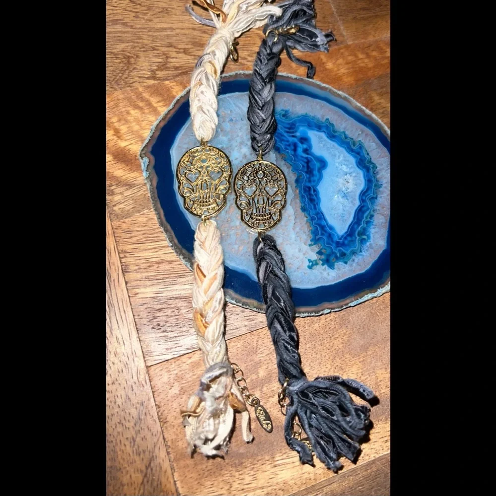 Two DollsKill Ettika Vintage Skull Ribbon Braided Bracelets with Gold Clasps